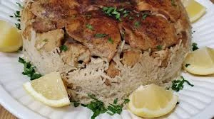 image about 🍽️ مقلوبة القرنبيط بالدجاج: وصفة لذيذة وسهلة بطعم شرقي أصيل