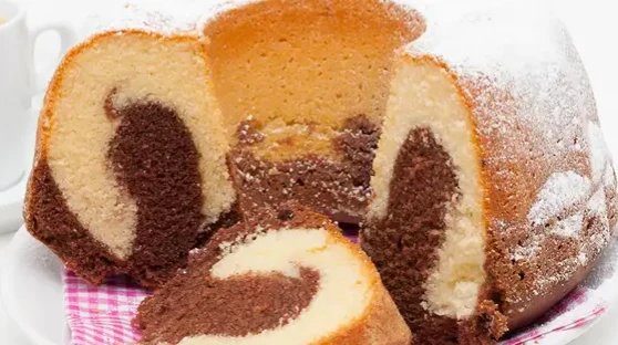 image about 🎂✨ طريقة عمل كيك فانيليا بالشوكولاتة — كيك هش ولذيذ بطعم مُدهش