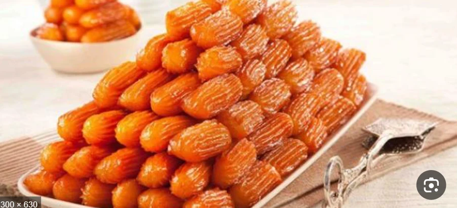 image about 🍯✨ طريقة عمل بلح الشام المقرمش في البيت مثل المحلات (أكثر من 600 كلمة) 🥮🔥